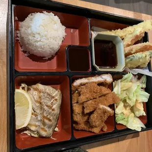Lunch bento box with ton katsu, mackerel and tempura