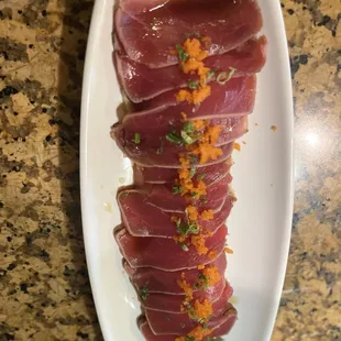 a plate of raw tuna