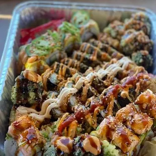 a close up of a container of sushi