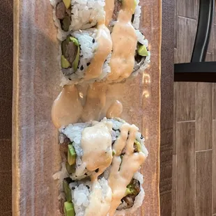 Cowboy roll has cooked steak and spicy mayo