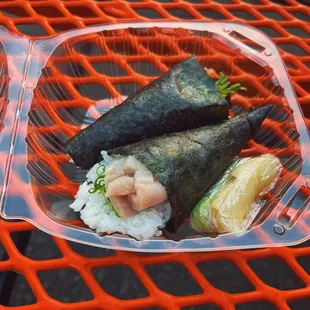 two pieces of sushi on a plate