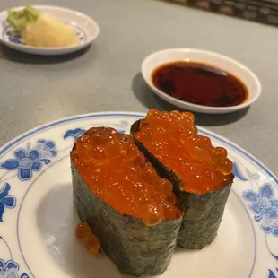 a plate of sushi on a counter
