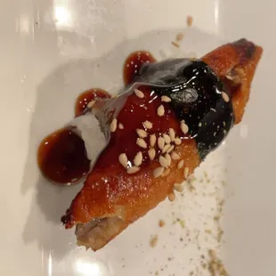 a piece of sushi on a plate