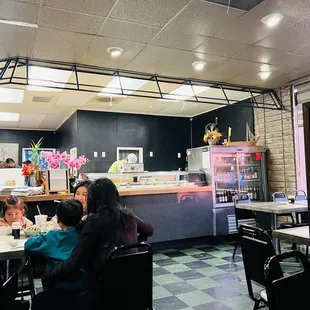 a group of people eating at a restaurant