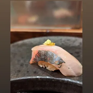 a piece of sushi on a plate