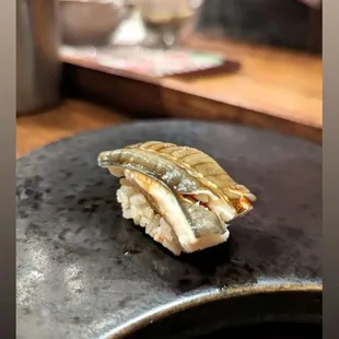 a piece of sushi on a plate