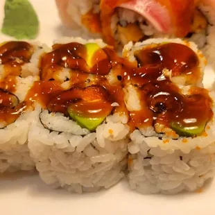 a plate of sushi rolls on a table