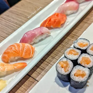 two plates of sushi on a table