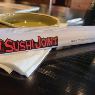 the sushi joint logo on a napkin