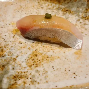 a sushi on a plate