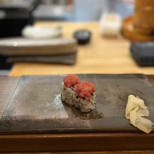 a piece of sushi on a plate