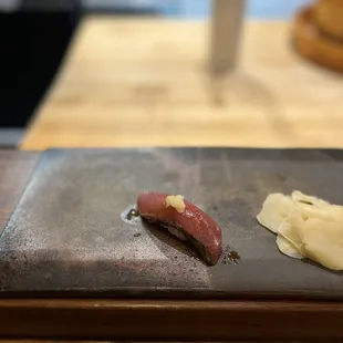 two pieces of sushi on a plate