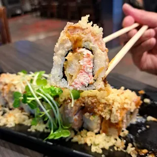 June 2023 Roll of the Month: Dracula Roll = California roll with tempura flakes &amp; shrimp. Can&apos;t taste avocado or salmon. Grassy microgreens.