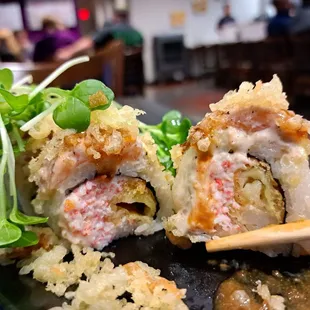 June 2023 Roll of the Month: Dracula Roll = California roll with tempura flakes &amp; shrimp. Can&apos;t taste avocado or salmon. Grassy microgreens.