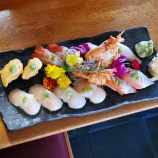 Starting from top left:: uni, ama ebi, Hamachi, 2 orders of hotatae and sake belly