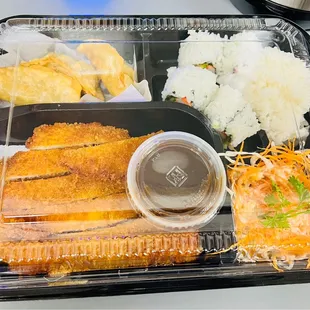 a plastic tray with a variety of food items