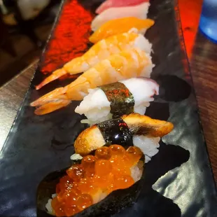 a close up of a plate of sushi