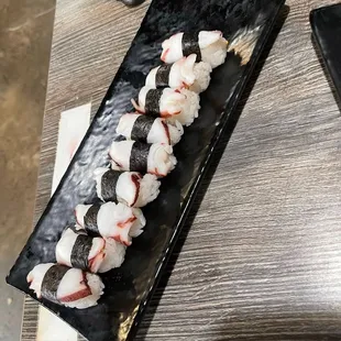 a plate of sushi on a table