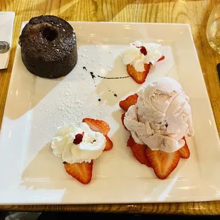Chocolate cake with strawberry ice cream