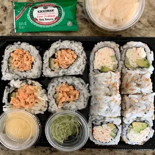 a sushi box with a variety of sushi