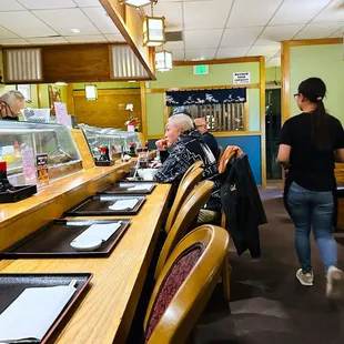 a group of people in a restaurant
