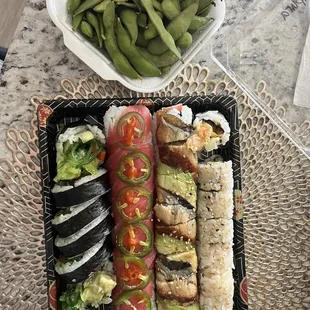 Edemame Left to right: Vegetable Roll; Grace Roll; Dragon Roll; Shrimp Tempura Roll