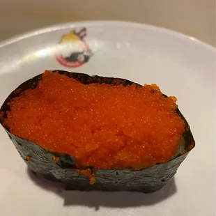 a piece of sushi on a plate