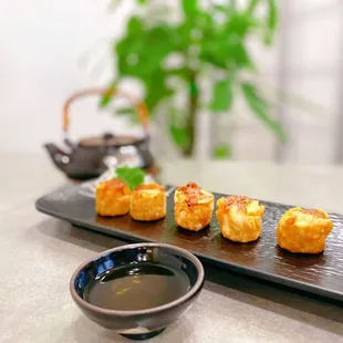 a plate of sushi on a table