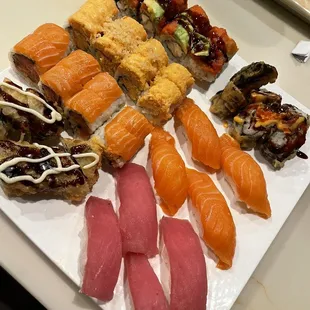 (left to right): kani tempura roll, volcano roll, sea angel roll, salmon sushi, amazing roll, las vegas roll, tuna sushi
