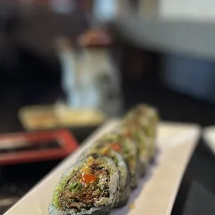 a sushi roll on a plate