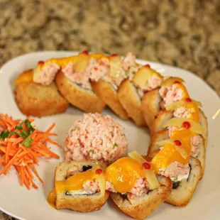 a plate of sushi rolls