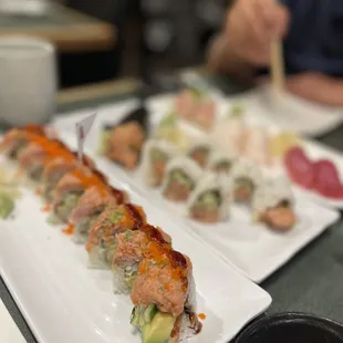 two plates of sushi on a table