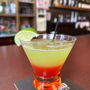 a margarita with a slice of lime