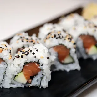 a plate of sushi rolls