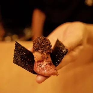 the perfect one biter sushi A 5 wagyu Hokkaido uni and winter black truffle