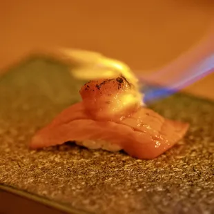 dry aged king salmon topped with tomato and truffle butter