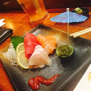 Sashimi plate with a delicious sauce inside the cucumber!