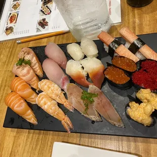 seared salmon, salmon, hamachi, shrimp, scallop, surf clam, albacore, crab, ikura, flying fish roe, &amp; spicy scallop