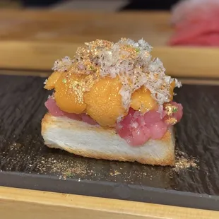 toro, uni, shaved truffle, chives, gold powder
