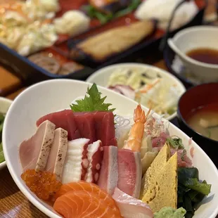 a variety of sushi dishes on a table