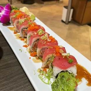 a long rectangular plate of sushi