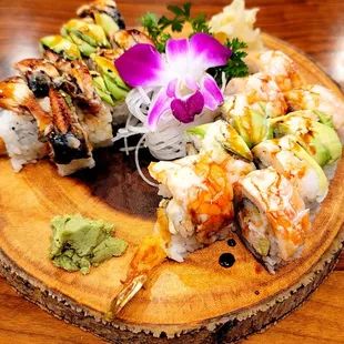 L- Dragon Roll: spicy tuna, shrimp tempura w/ eel &amp; avocado on top.  R- Tiger Roll: snow crab, shrimp tempura w/ avocado &amp; shrimp on top.