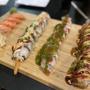 a variety of sushi on a cutting board