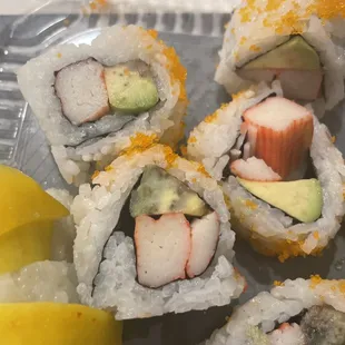 a plate of sushi rolls