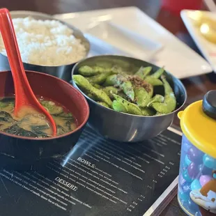 three bowls of food on a table