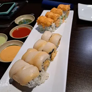 a long rectangular plate of sushi