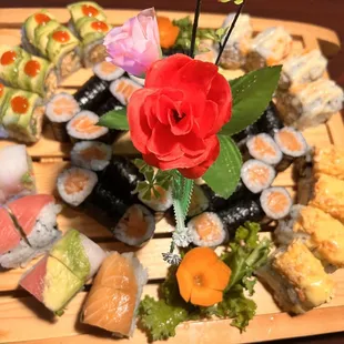 a platter of sushi and rolls