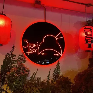 a neon sign for sushi lucy