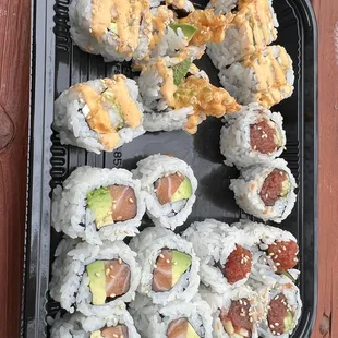 777 roll, salmon and avocado, spicy tuna