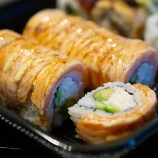 a plate of sushi rolls